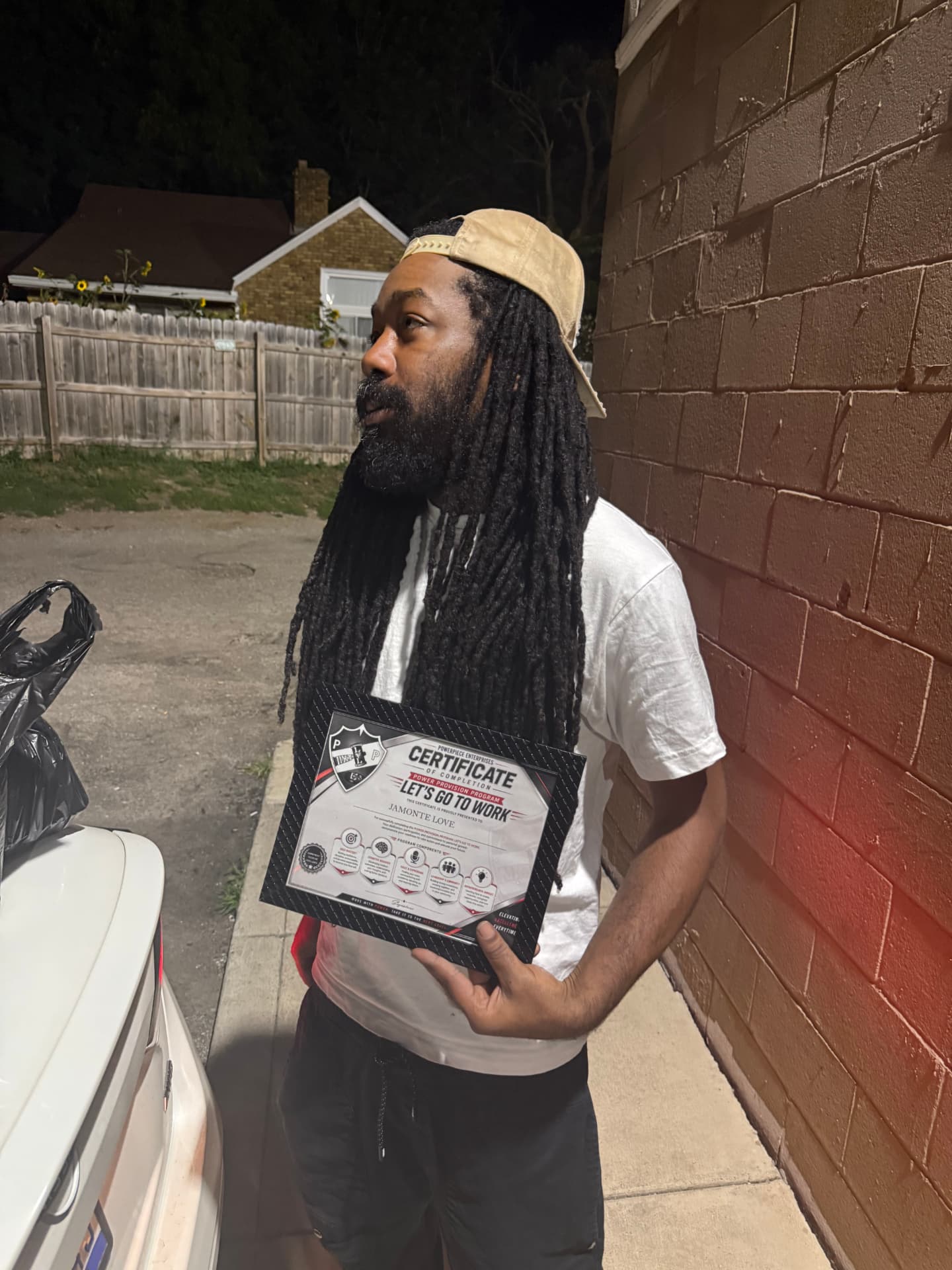 Let's Go to Work participant with his Power Provision Program certificate of completion