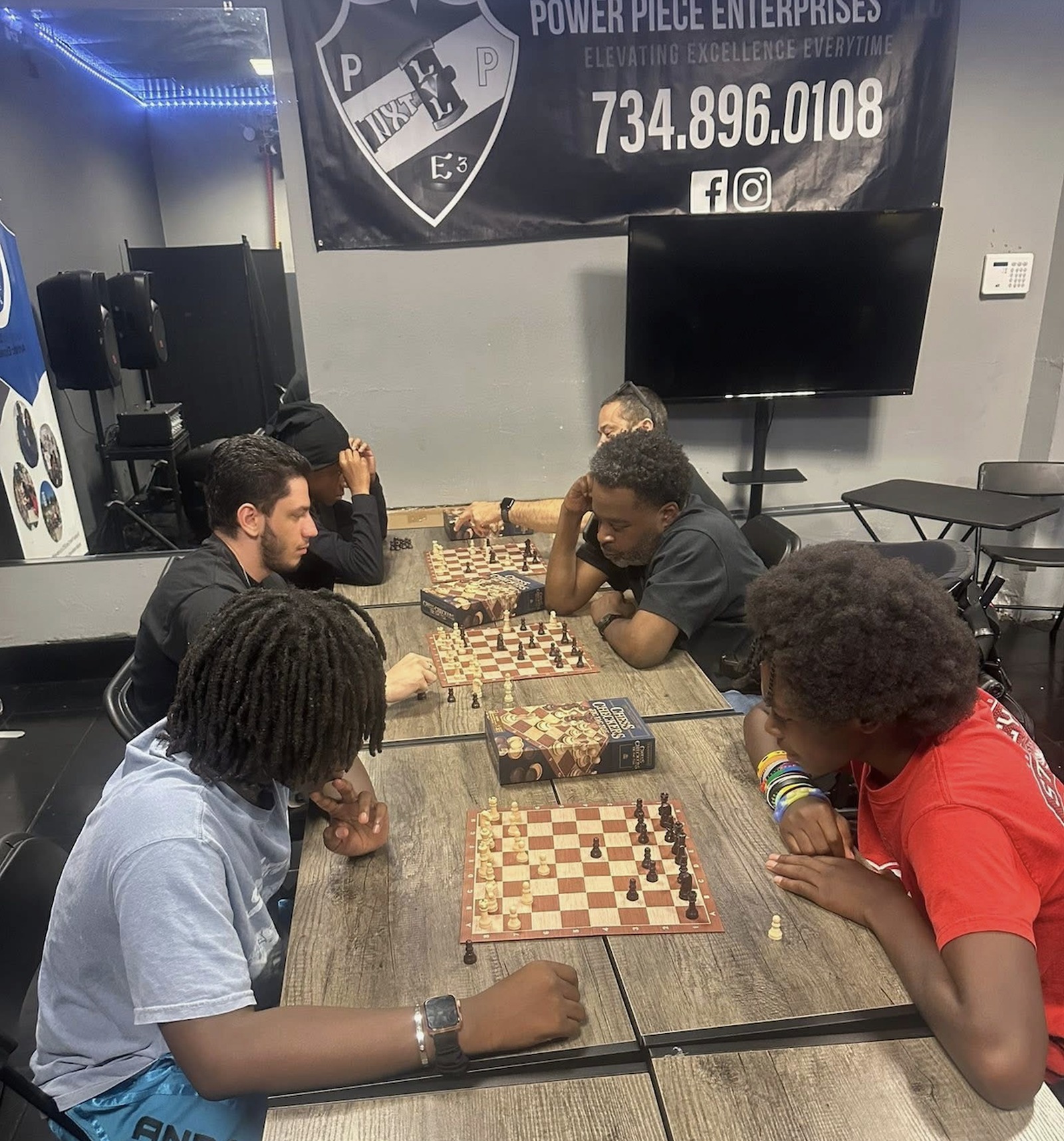 Community members gathered for chess and connection at a Power Piece Enterprises event